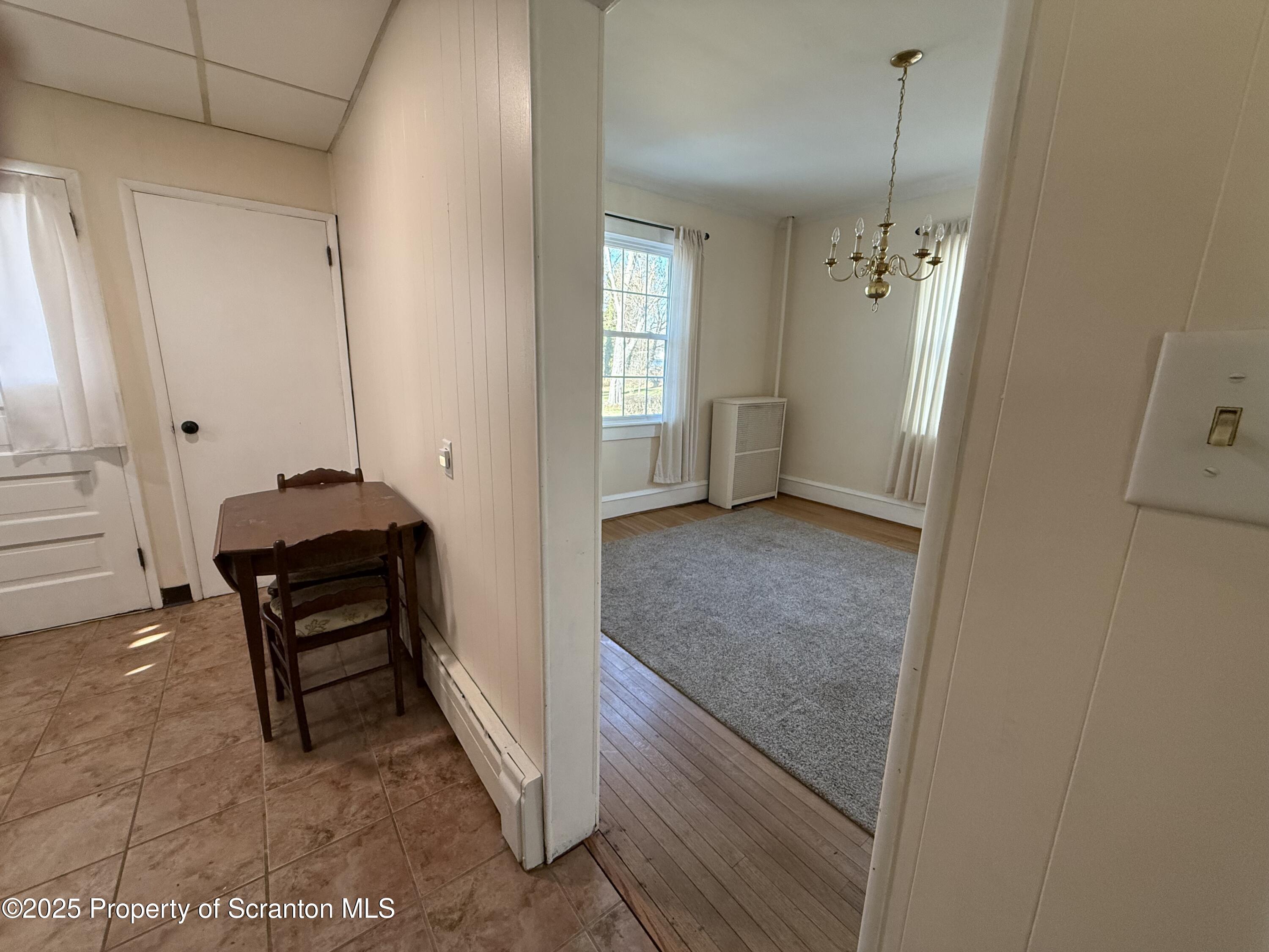 301 Monument Avenue Wyoming, PA 18644 - Photo 12 of 37 a view of a hallway with workspace and a window