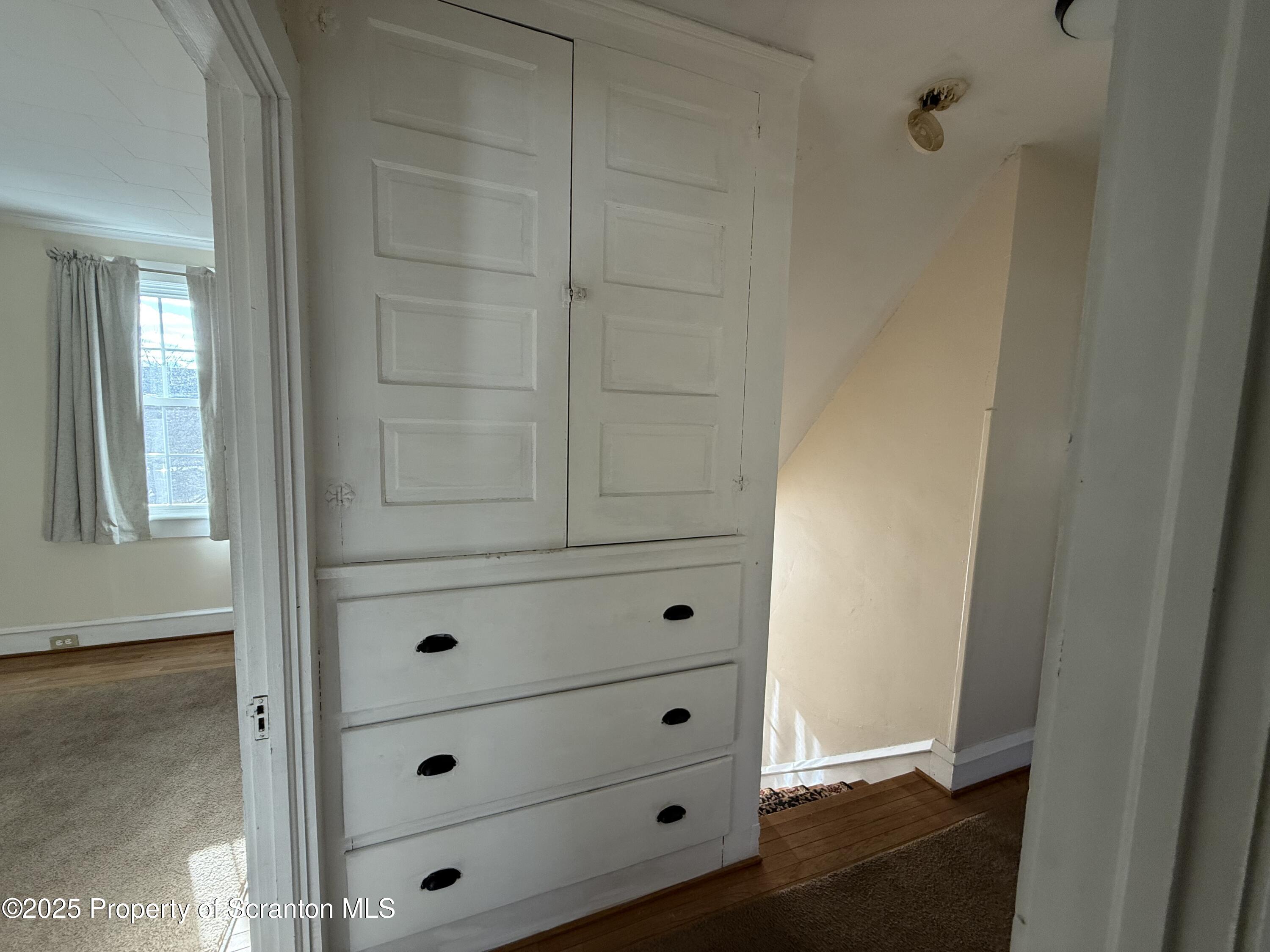 301 Monument Avenue Wyoming, PA 18644 - Photo 19 of 37 a view of a dresser