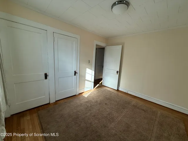 an empty room with a empty space and window