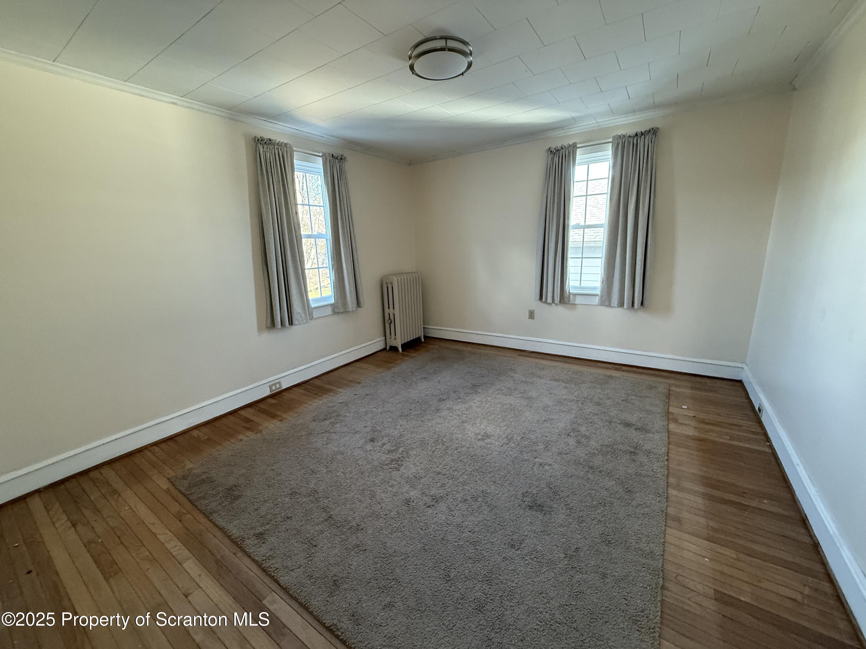 301 Monument Avenue Wyoming, PA 18644 - Photo 26 of 37 an empty room with windows