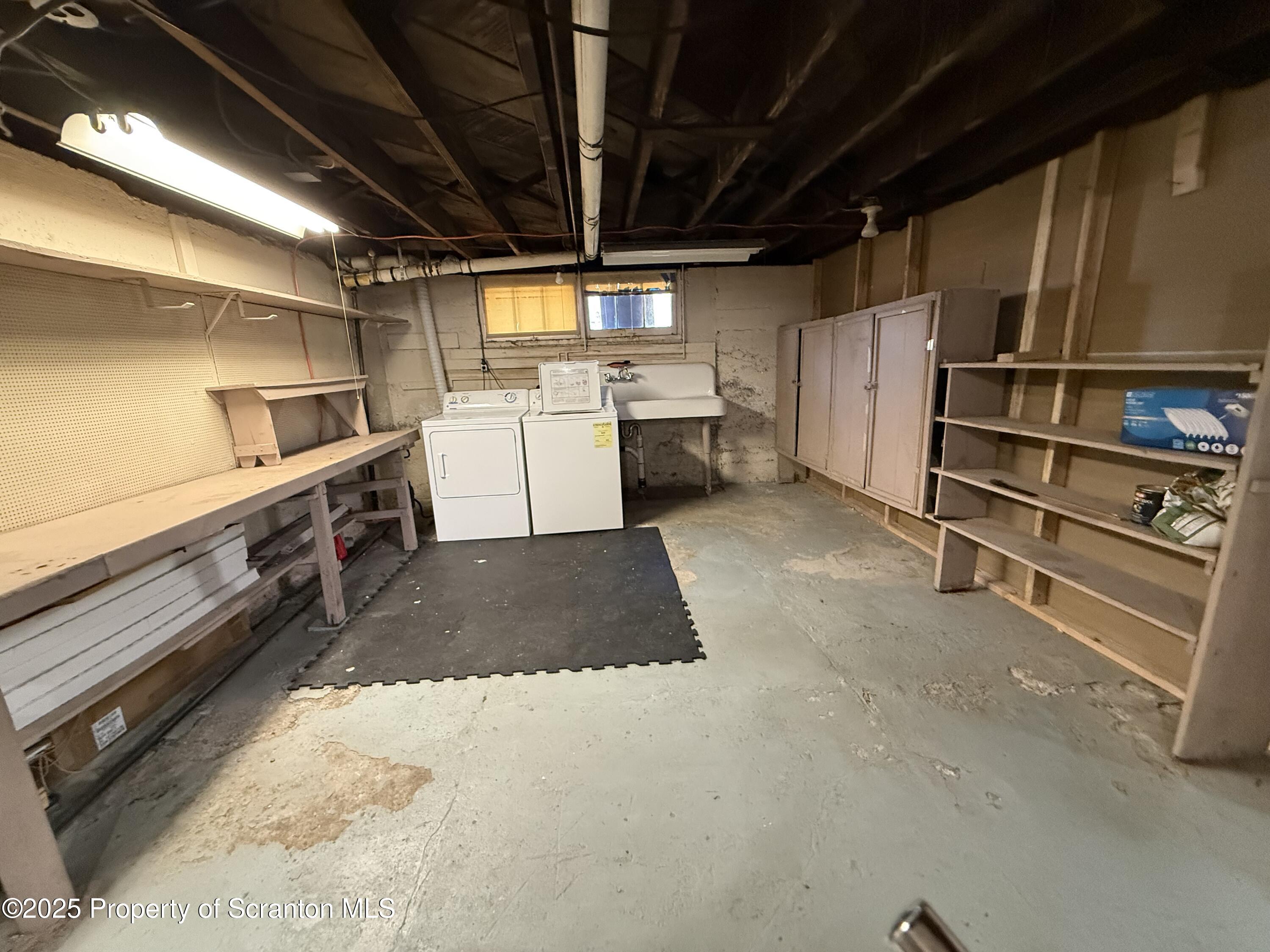 301 Monument Avenue Wyoming, PA 18644 - Photo 33 of 37 a kitchen with a sink and cabinets