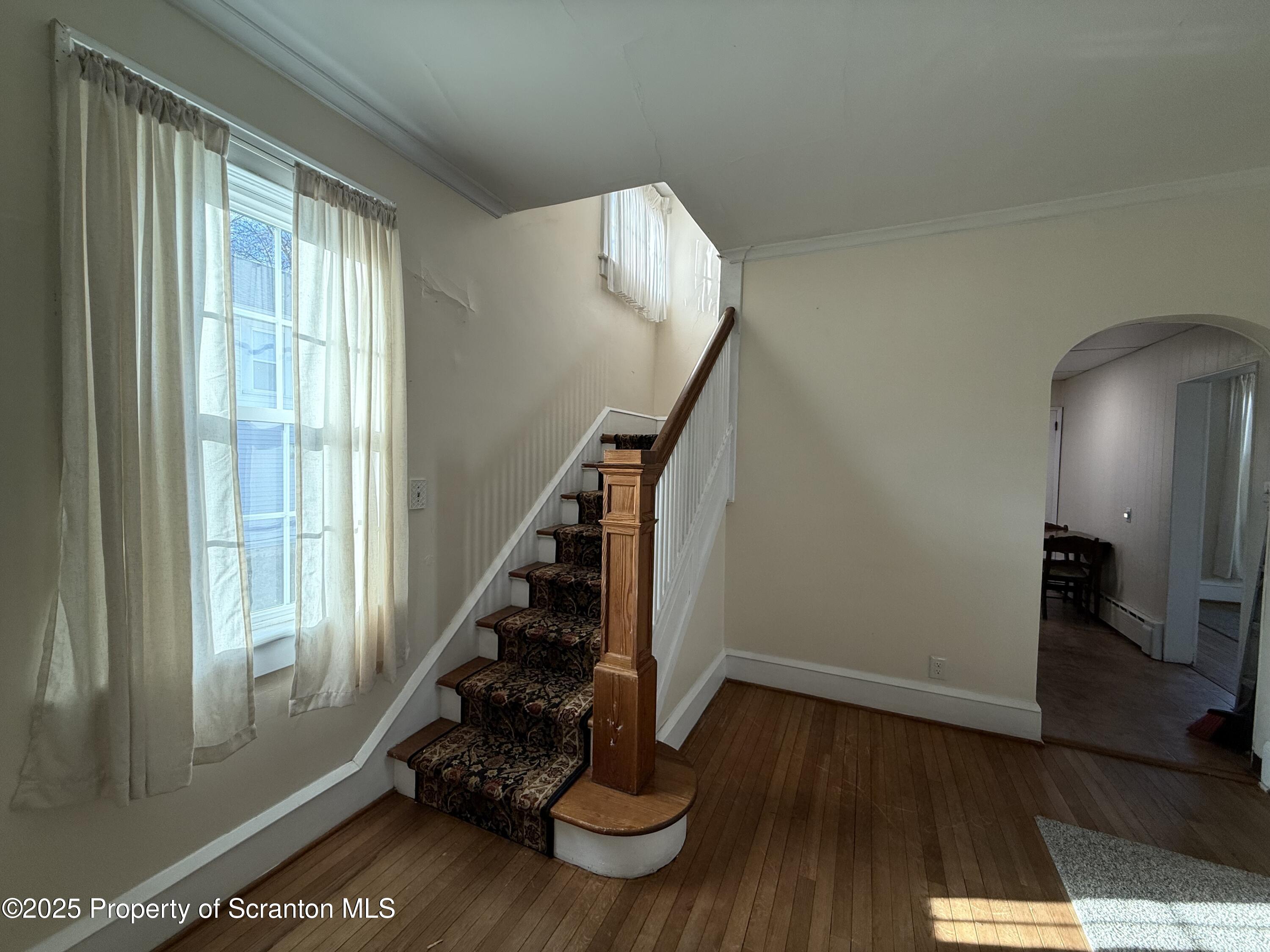 301 Monument Avenue Wyoming, PA 18644 - Photo 7 of 37 a view of entryway with wooden floor