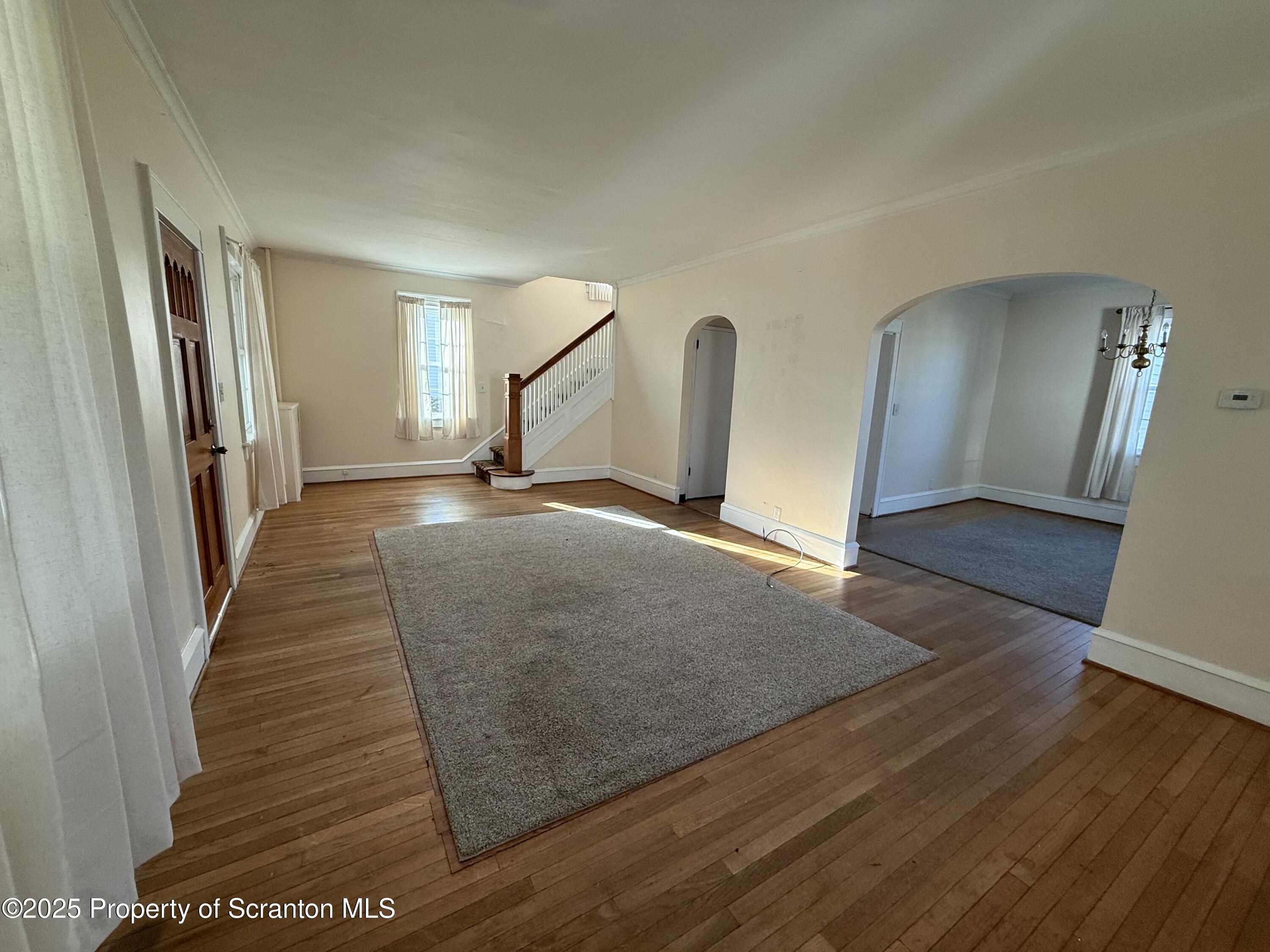 301 Monument Avenue Wyoming, PA 18644 - Photo 9 of 37 a view of a hallway with wooden floor