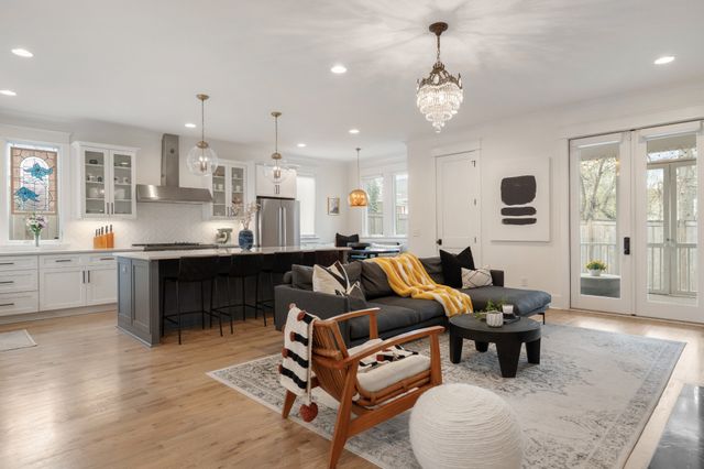 a kitchen with a sink stove and cabinets