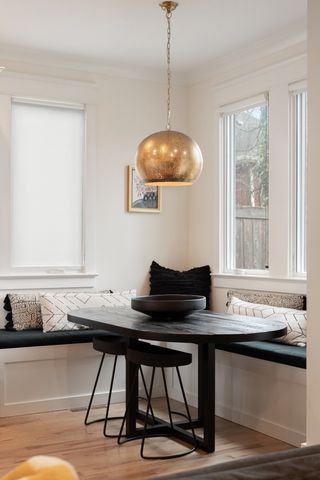 a bed sitting in a spacious bedroom next to a window