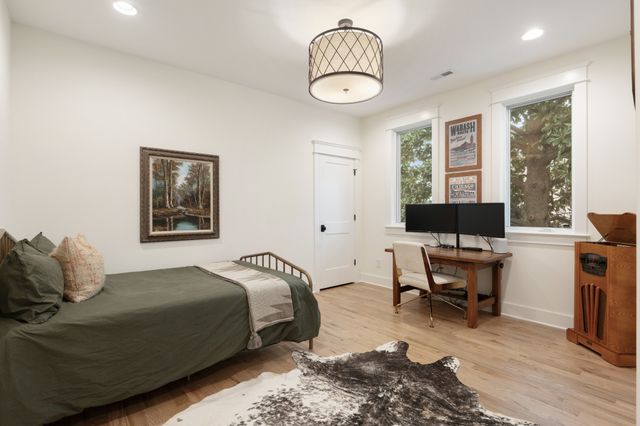 a kitchen with stainless steel appliances granite countertop a sink a stove and a refrigerator