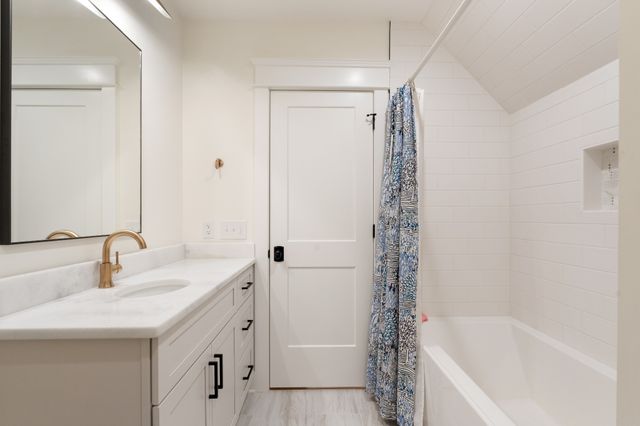 a white stove top oven sitting inside of a kitchen