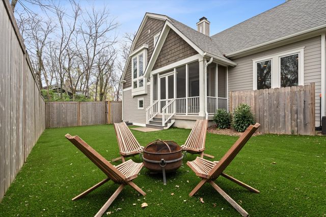 a view of a dining room kitchen and a chandelier