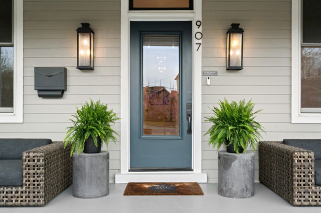 a view of a hallway with entryway wooden floor and front door