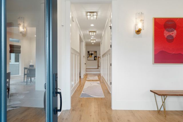 a en suite bathroom with a granite countertop sink and a mirror