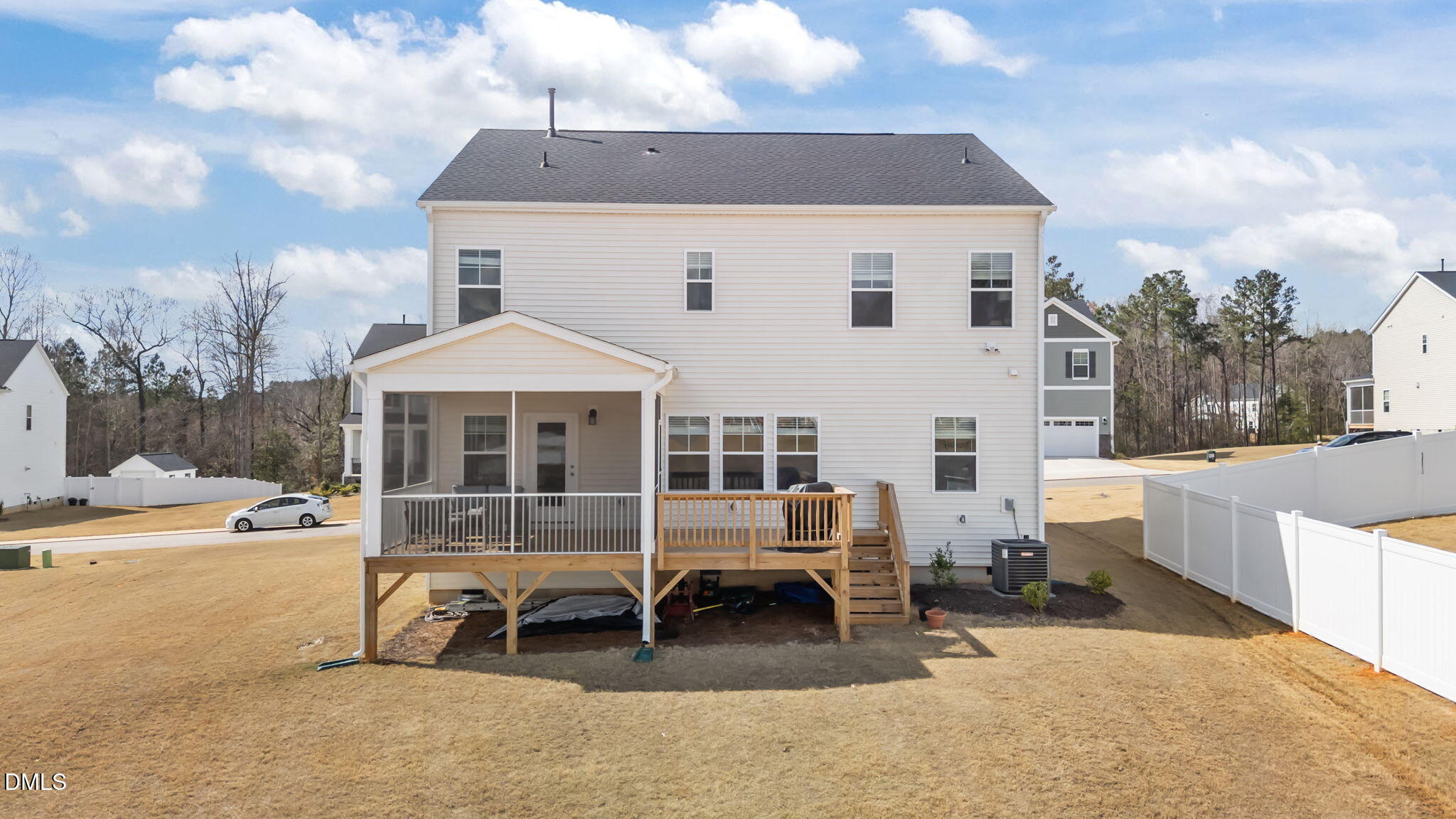 103 Ellsworth Court Garner, NC 27529 - Photo 13 of 48 a view of a white house with a yard and sitting area