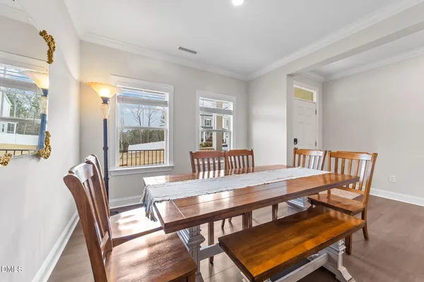 a view of a patio with a table and chairs