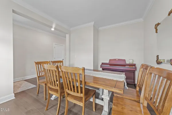 a view of a dining room with furniture and a window