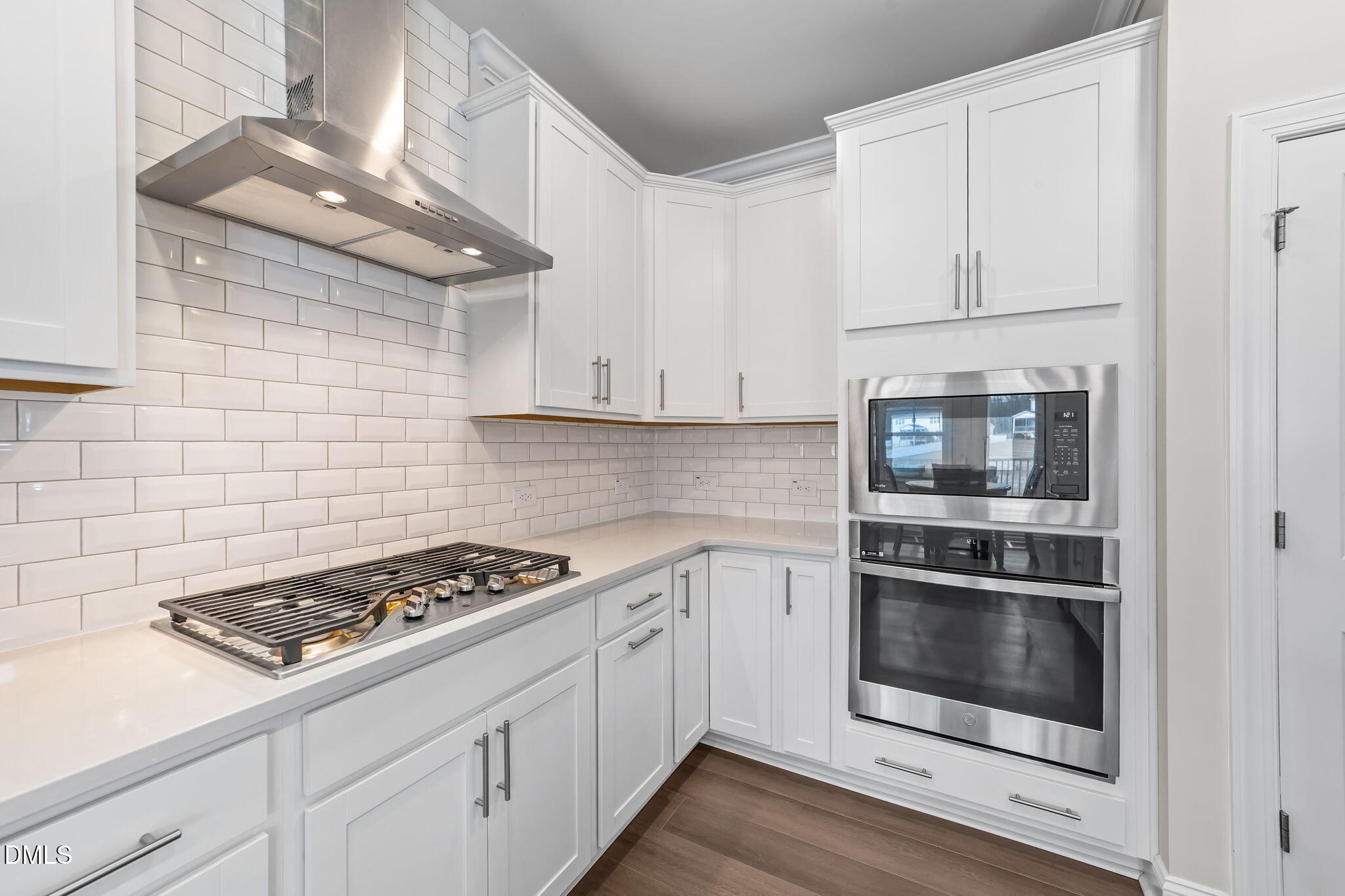 103 Ellsworth Court Garner, NC 27529 - Photo 20 of 48 a kitchen with white cabinets and appliances