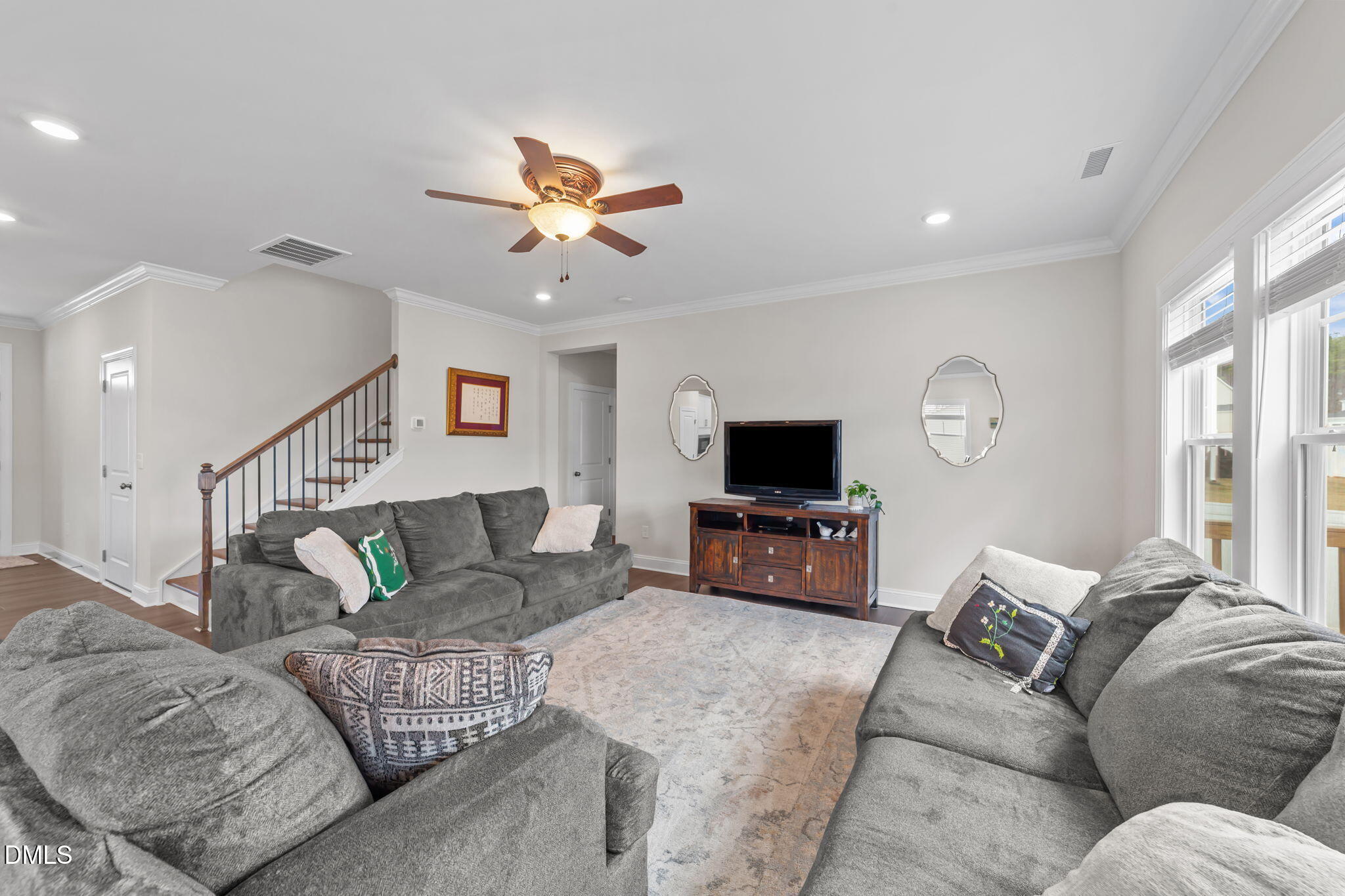 103 Ellsworth Court Garner, NC 27529 - Photo 23 of 48 a living room with furniture and a flat screen tv