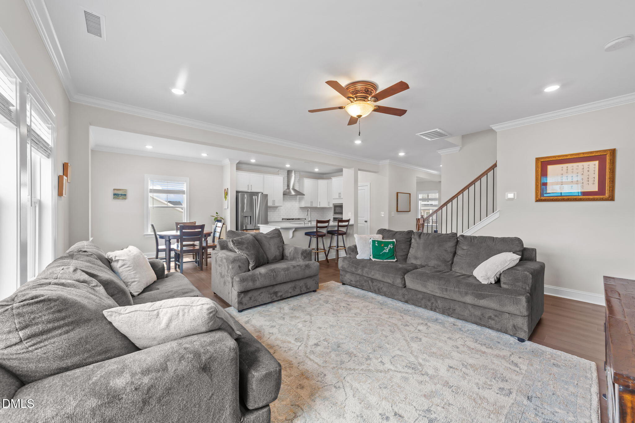 103 Ellsworth Court Garner, NC 27529 - Photo 24 of 48 a living room with furniture kitchen view and a chandelier