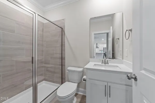 a living room with furniture kitchen view and a chandelier