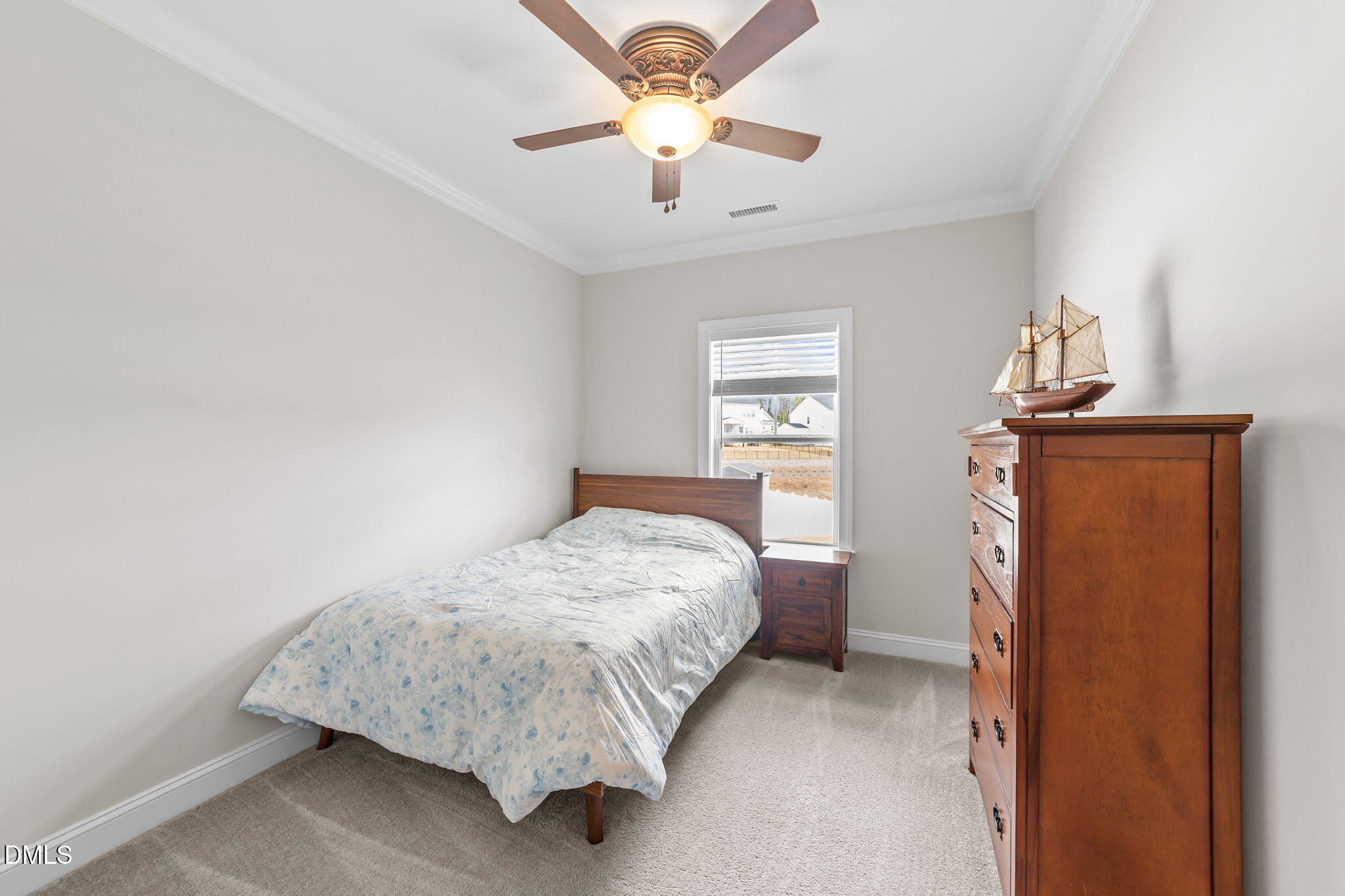 103 Ellsworth Court Garner, NC 27529 - Photo 26 of 48 a bedroom with a bed and a chandelier