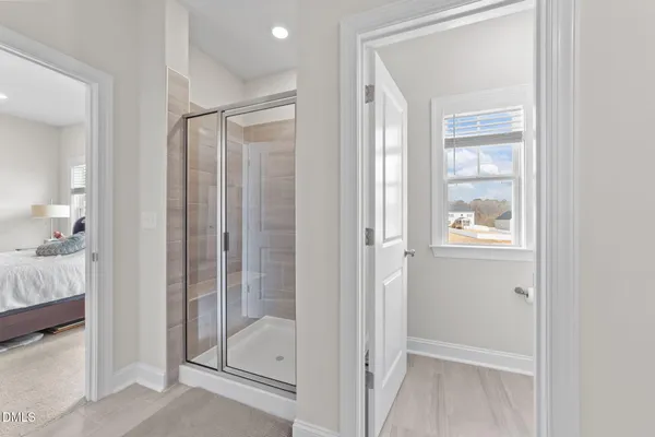 a bedroom with a bed and window