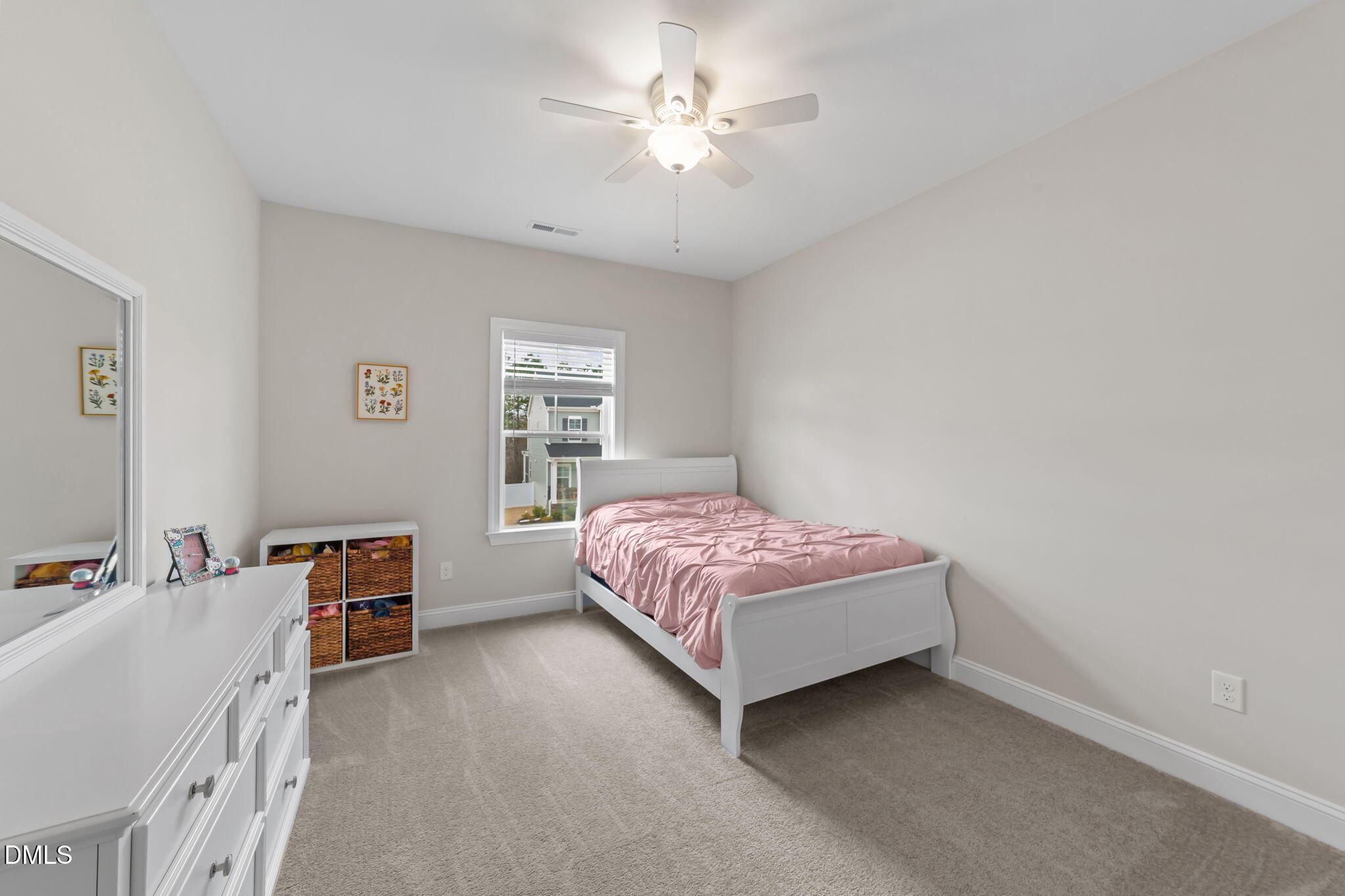 103 Ellsworth Court Garner, NC 27529 - Photo 34 of 48 a bedroom with a bed and a chandelier