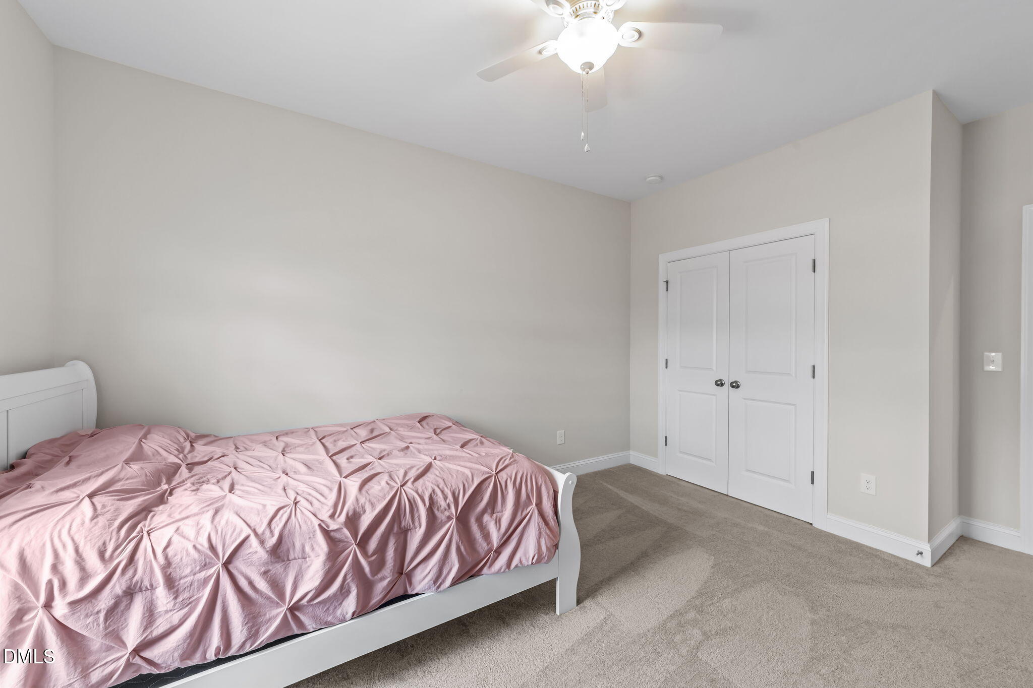 103 Ellsworth Court Garner, NC 27529 - Photo 35 of 48 a bedroom with a bed and a chandelier