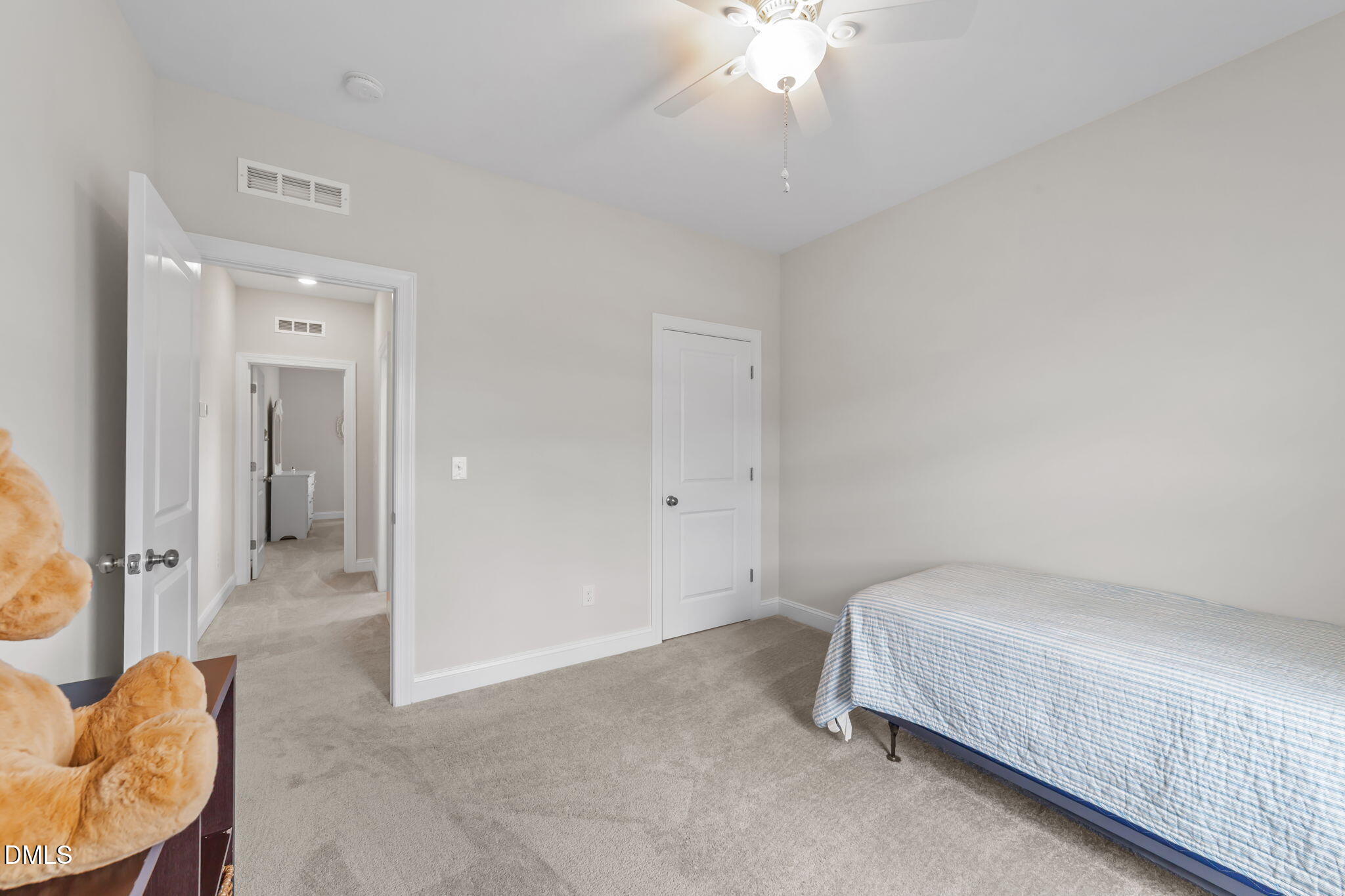 103 Ellsworth Court Garner, NC 27529 - Photo 39 of 48 a bedroom with a bed and a chandelier