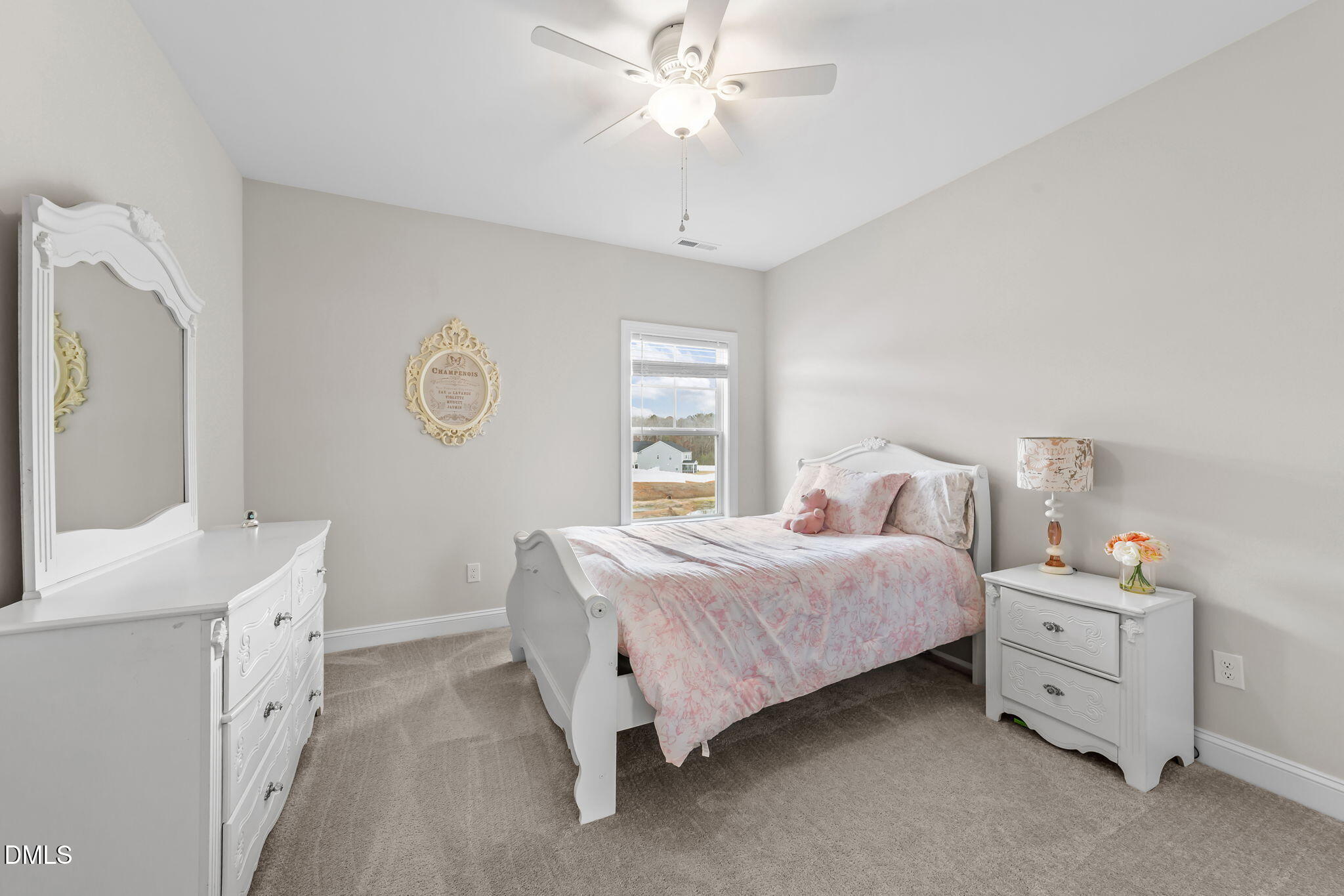 103 Ellsworth Court Garner, NC 27529 - Photo 41 of 48 a bedroom with a bed and a chandelier fan