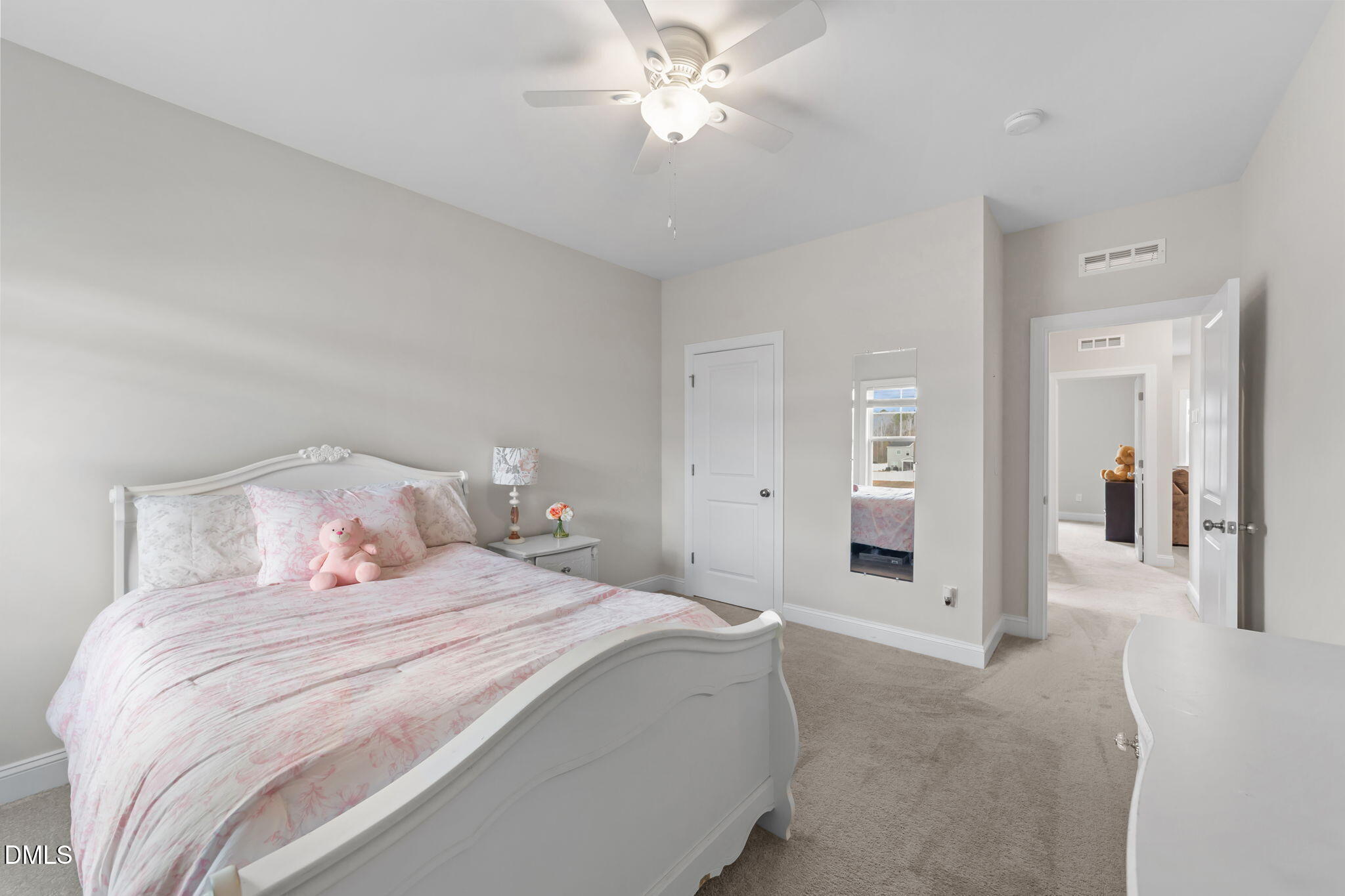 103 Ellsworth Court Garner, NC 27529 - Photo 42 of 48 a bedroom with a bed and a chandelier