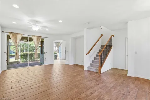 a view of an entryway with wooden floor