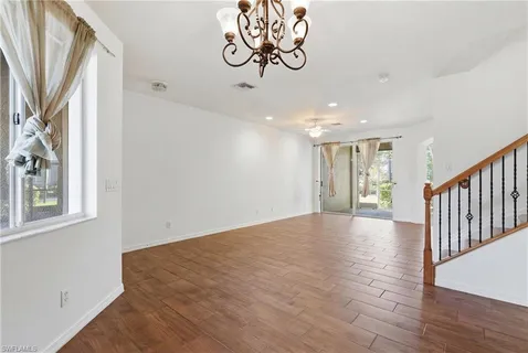 a view of an entryway with wooden floor