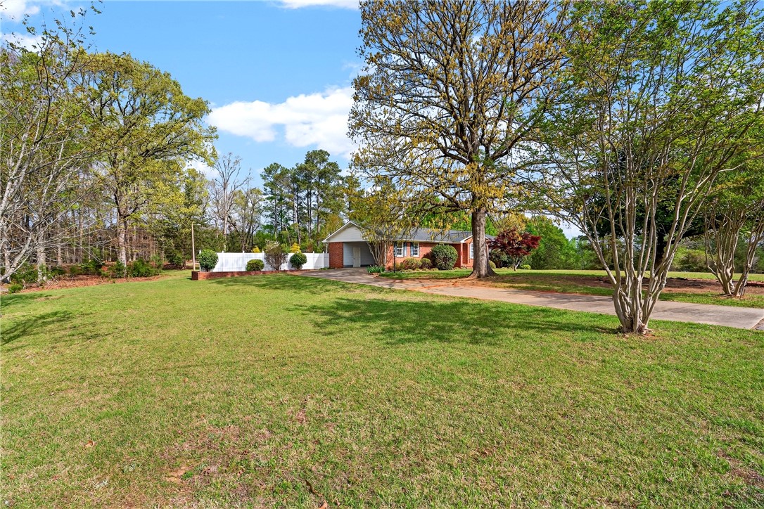 160 Burdette Circle Pendleton, SC 29670 - Photo 7 of 38 This charming brick ranch home sits on a spacious lot, offering a private yard and mature trees.