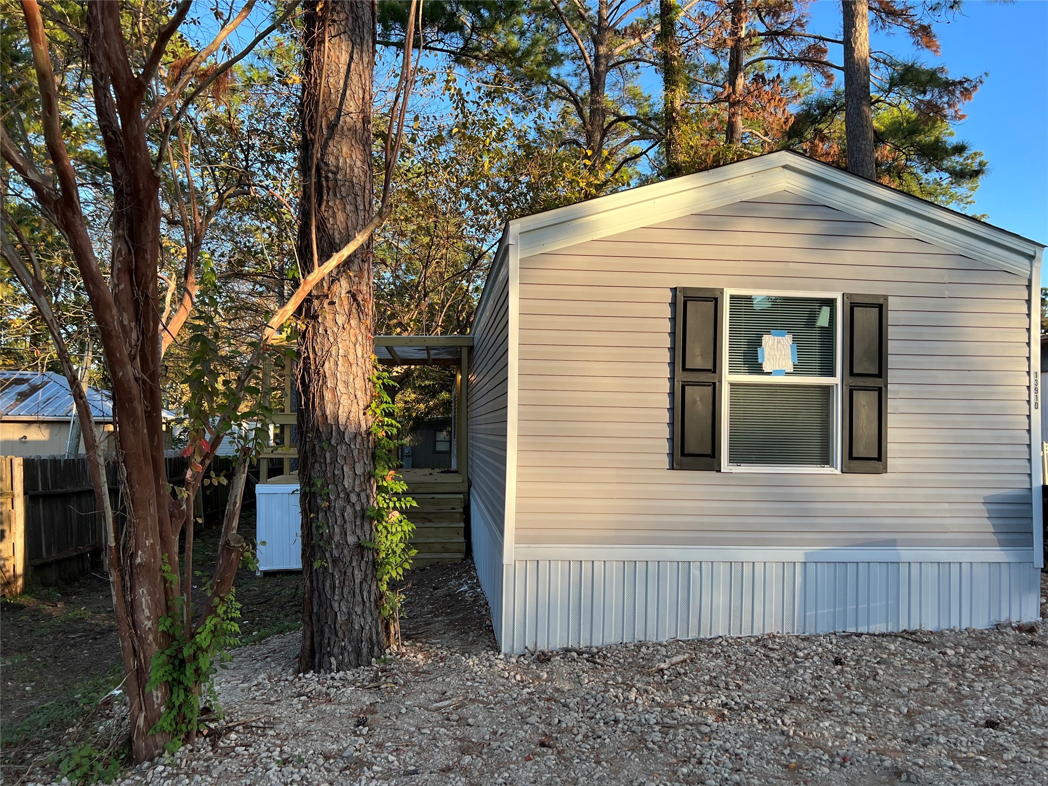 13910 Anchor Court Willis, TX 77318 - Photo 1 of 12 a view of a house with a yard and wooden fence