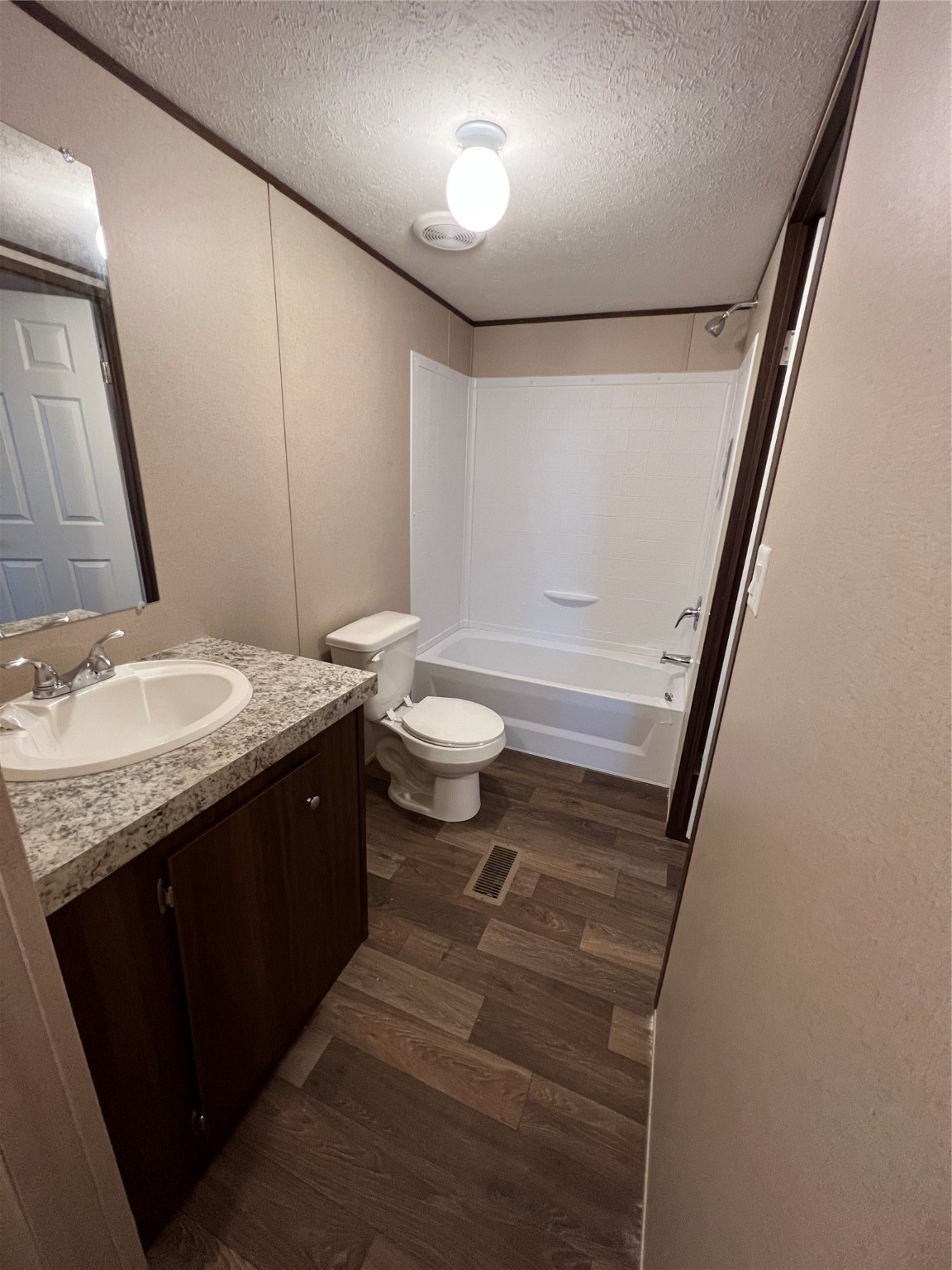 13910 Anchor Court Willis, TX 77318 - Photo 4 of 12 a bathroom with a granite countertop sink toilet and shower