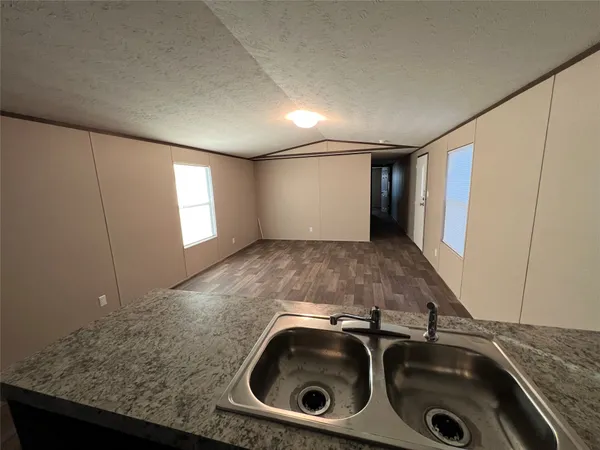 a view of a sink with washer and dryer