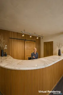 a bedroom with a bed and a large mirror