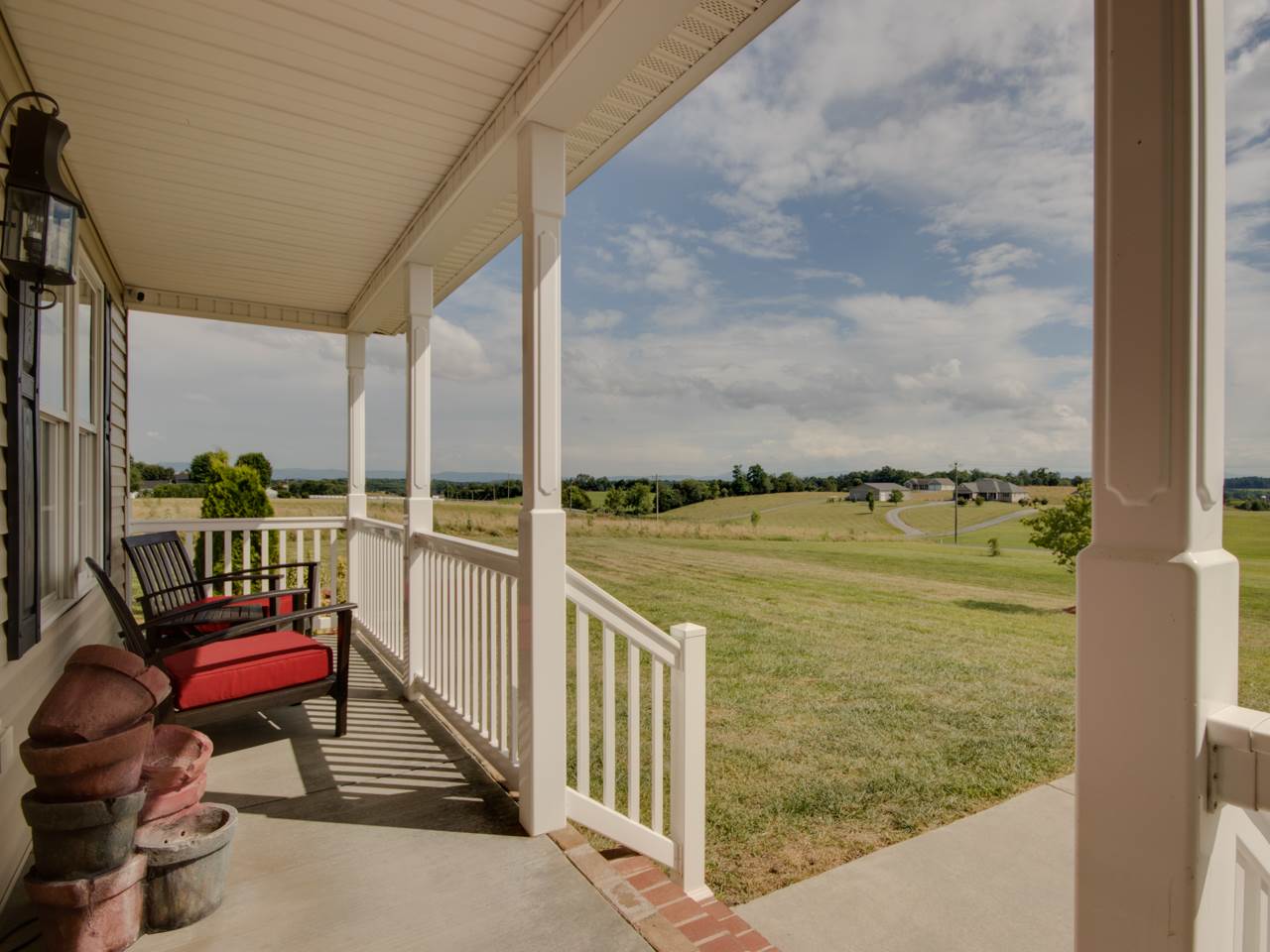 134 Bailey Road Fort Defiance, VA 24437 - Photo 14 of 42 a view of a balcony with chairs and wooden floor