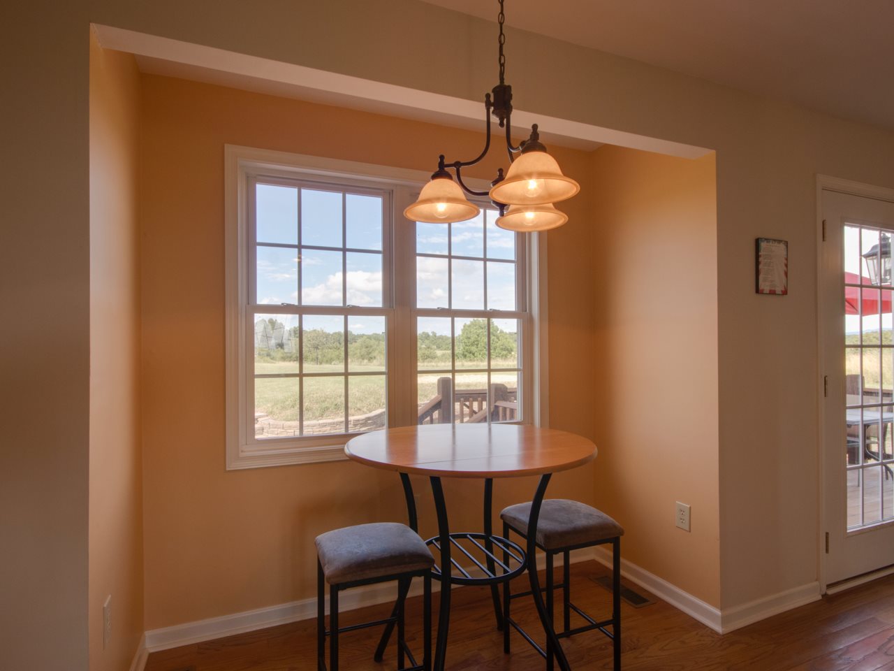 134 Bailey Road Fort Defiance, VA 24437 - Photo 20 of 42 a dining room with chandelier and wooden floor