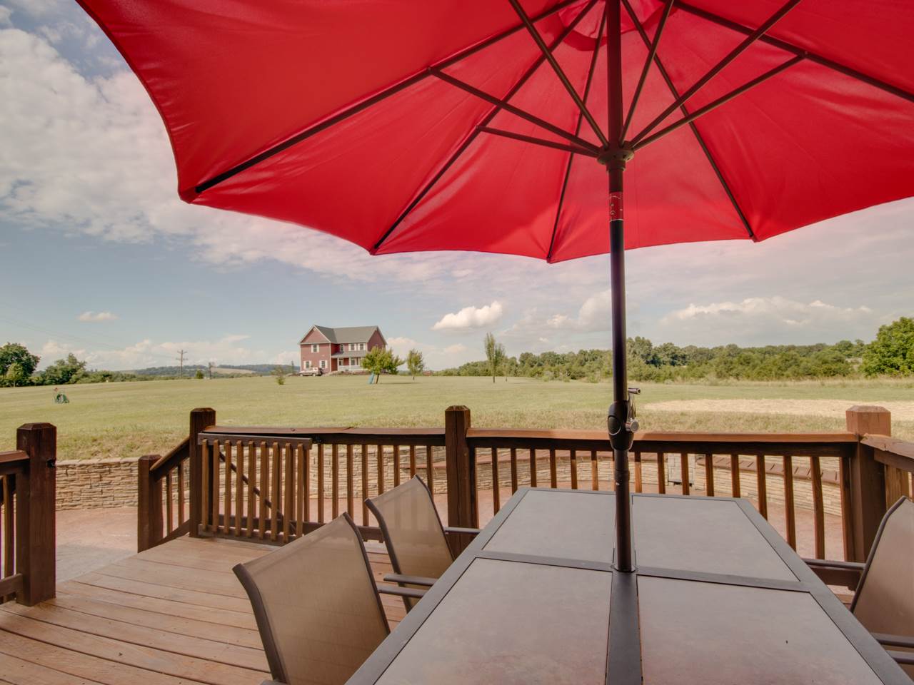 134 Bailey Road Fort Defiance, VA 24437 - Photo 10 of 42 a view of a lake with a table and chairs under an umbrella