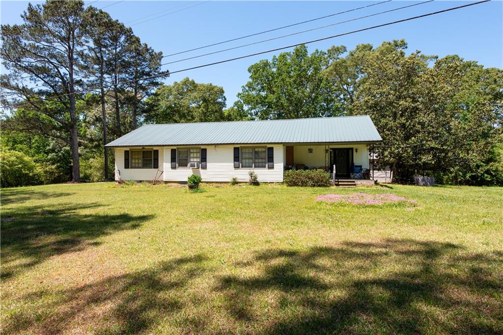 3024 Jackson Lake Road Mansfield, GA 30055 - Photo 1 of 1 a front view of a house with swimming pool