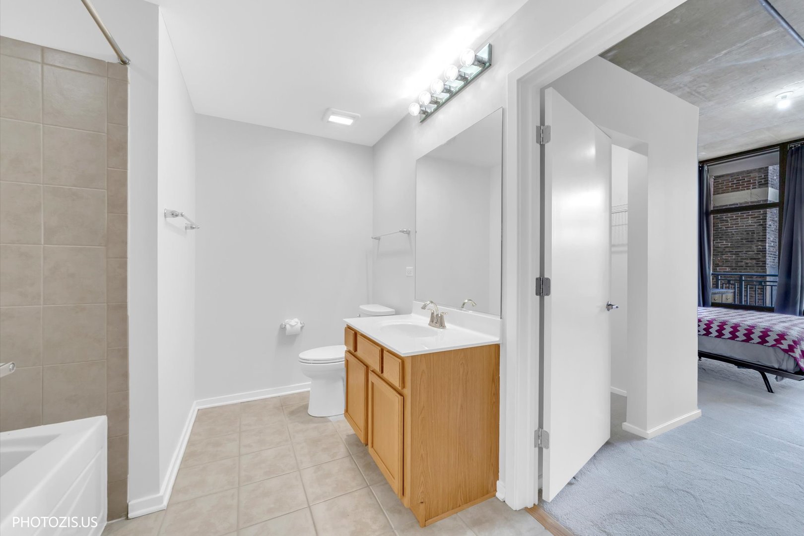 520 South State Street, Unit 712 Chicago, IL 60605 - Photo 17 of 28 a bathroom with a sink a toilet and shower