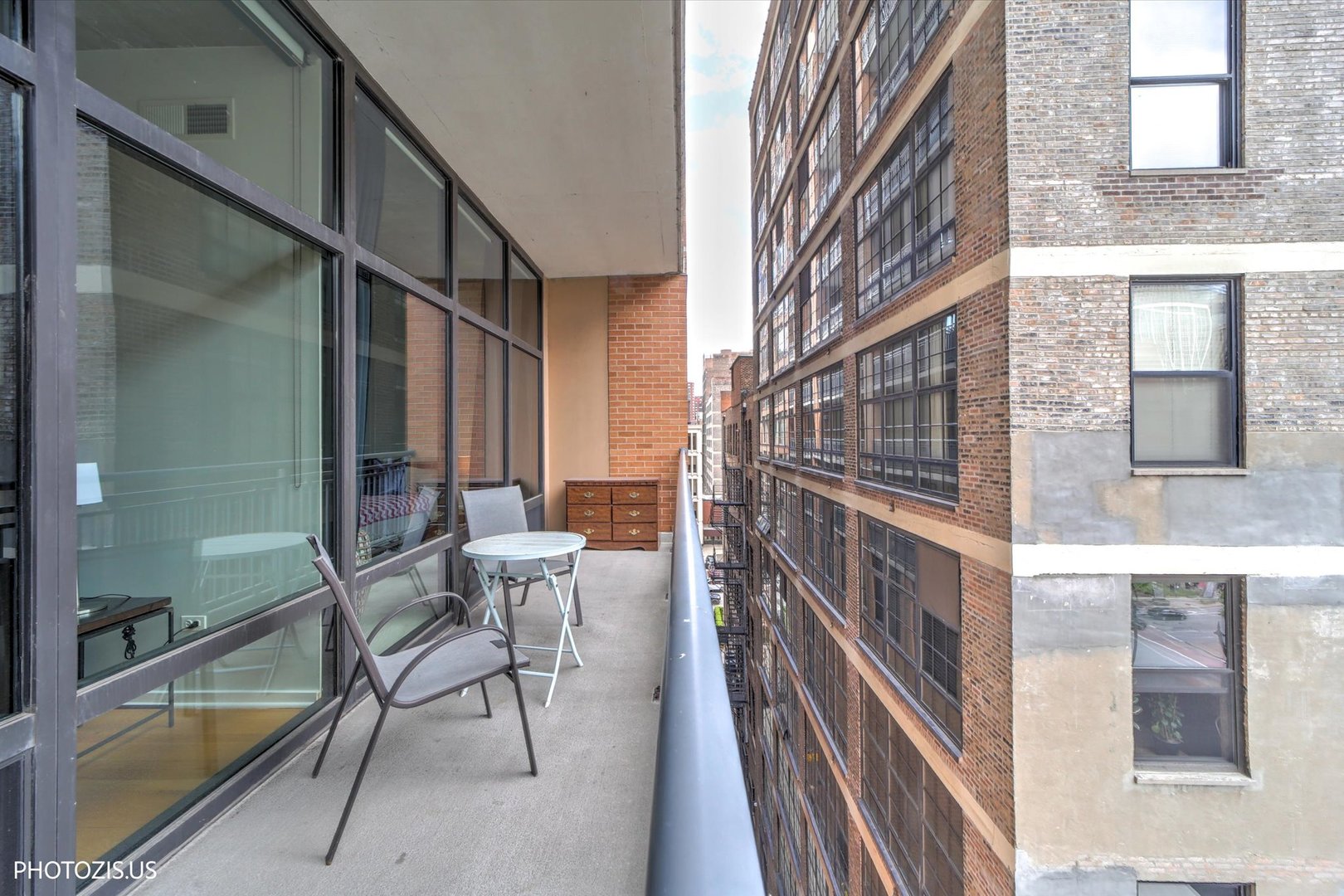 520 South State Street, Unit 712 Chicago, IL 60605 - Photo 19 of 28 a view of a patio with a dining table and chairs