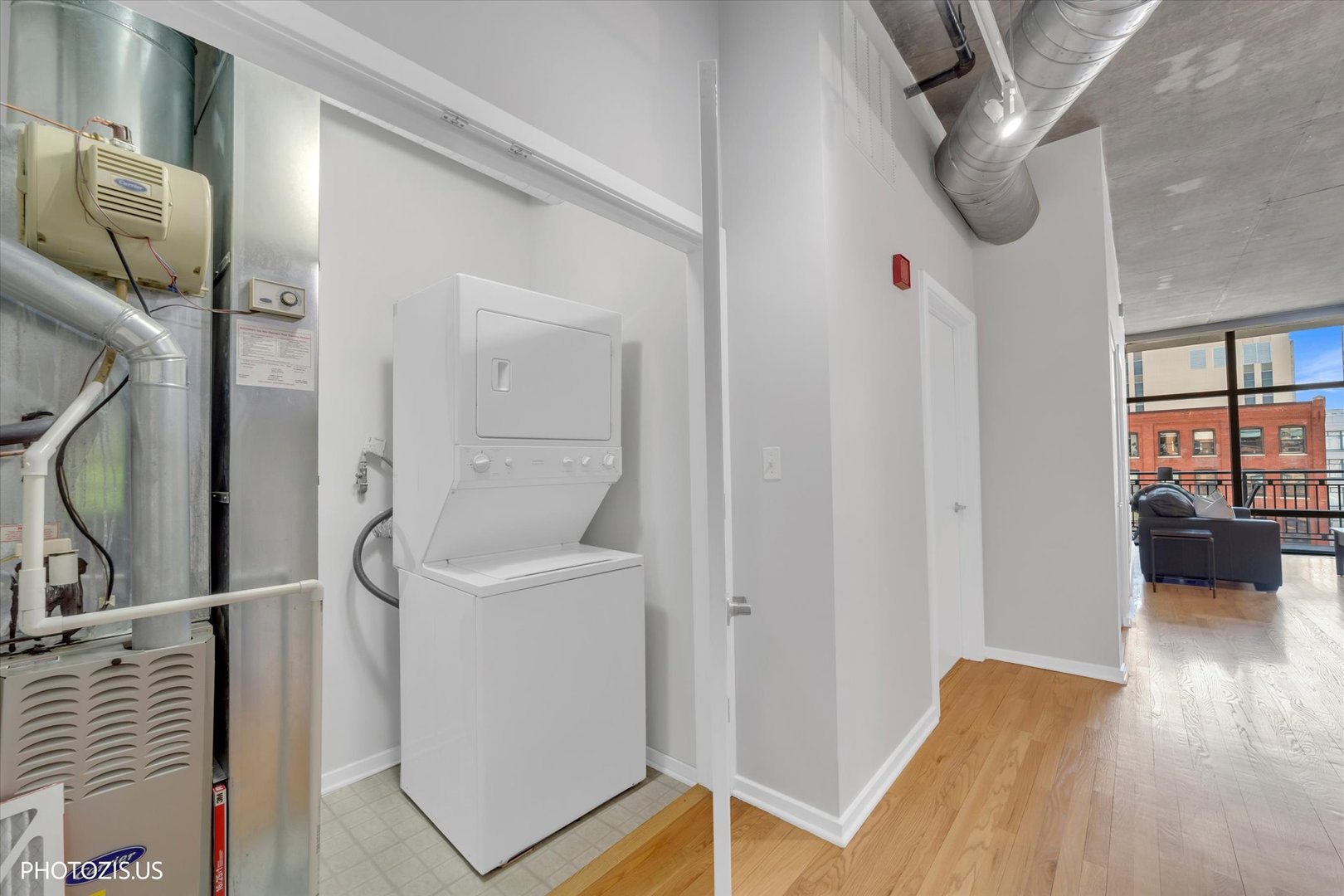 520 South State Street, Unit 712 Chicago, IL 60605 - Photo 5 of 28 a view of hallway with couch and wooden floor
