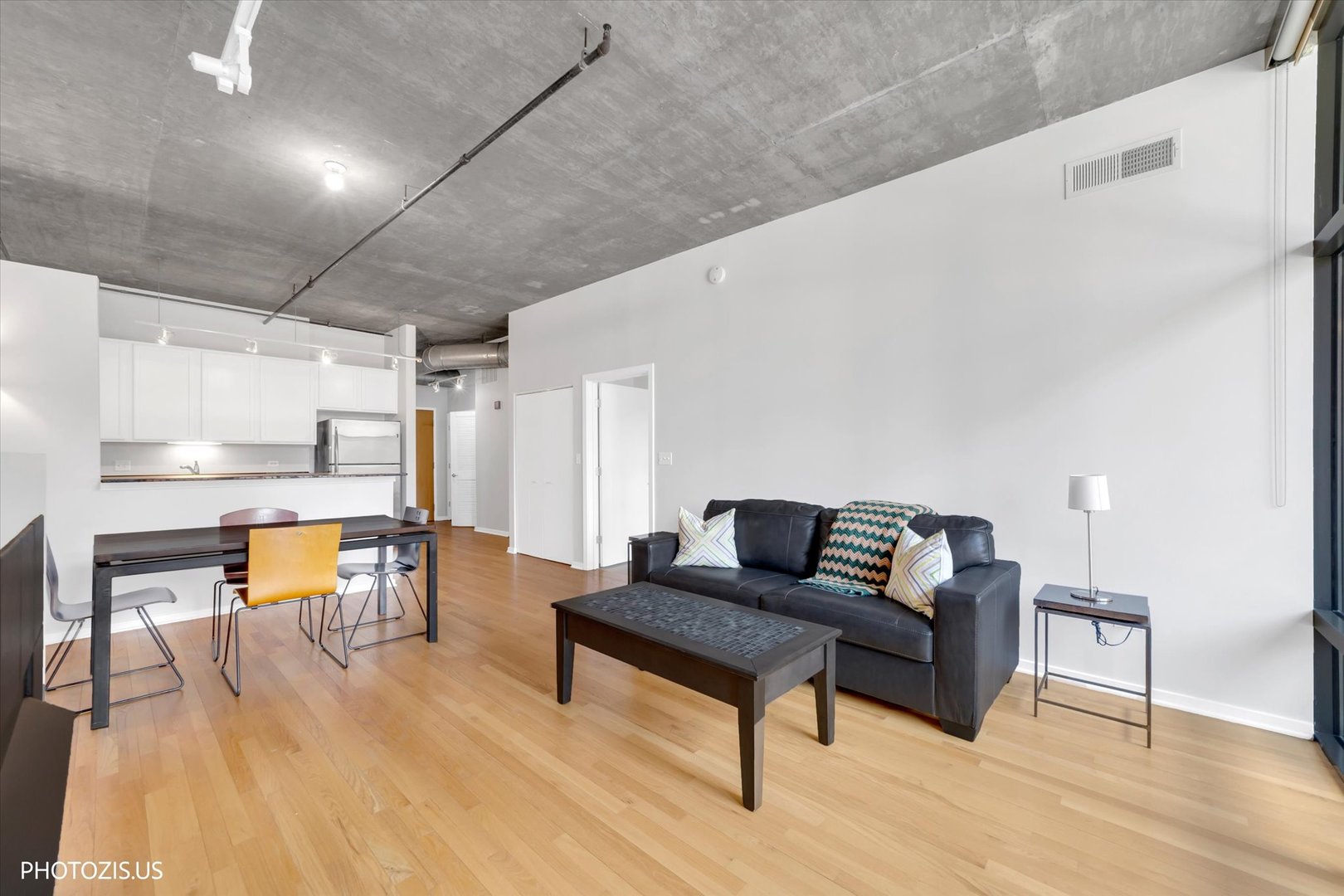 520 South State Street, Unit 712 Chicago, IL 60605 - Photo 8 of 28 a living room with furniture and a wooden floor