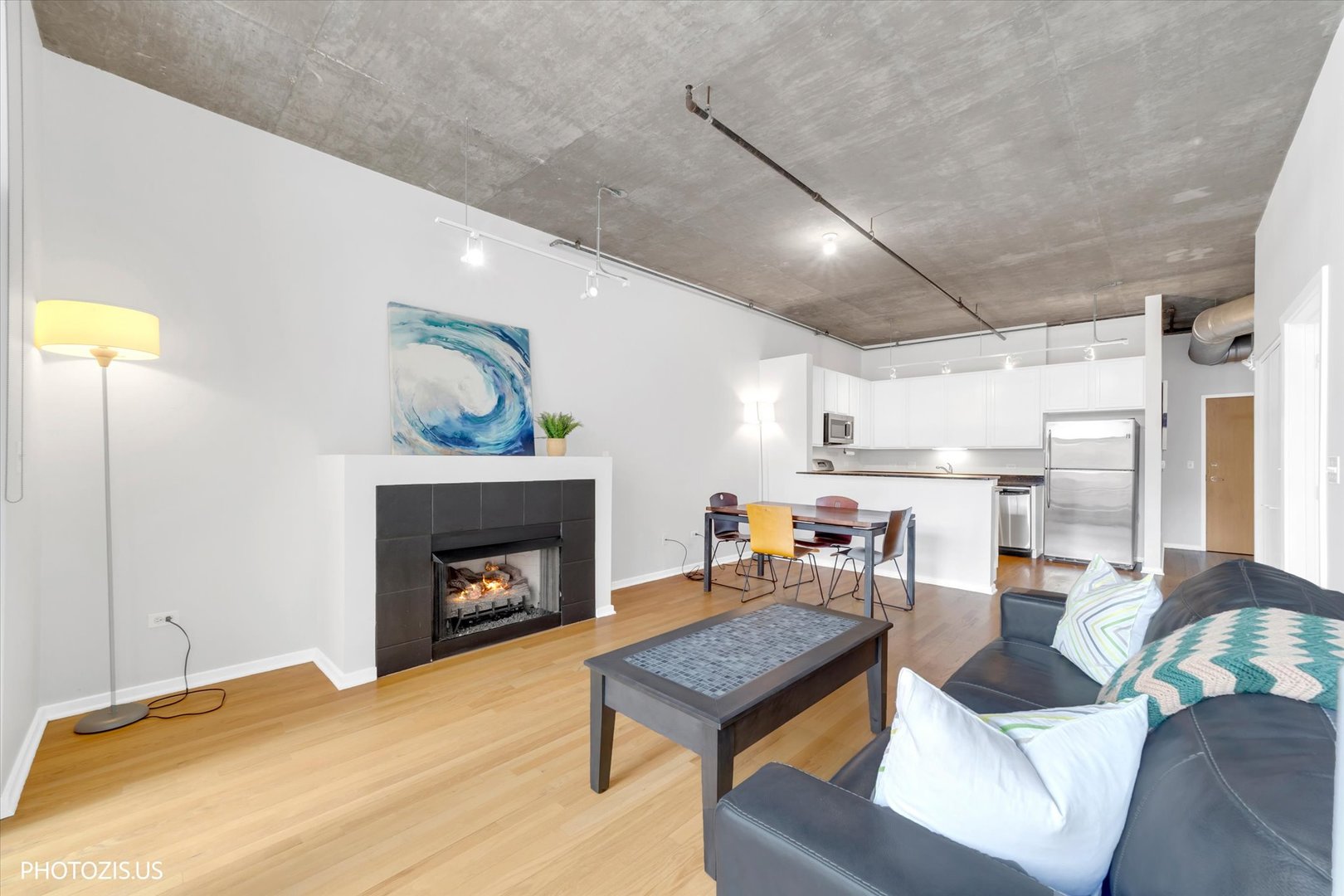 520 South State Street, Unit 712 Chicago, IL 60605 - Photo 9 of 28 a living room with furniture and a fireplace