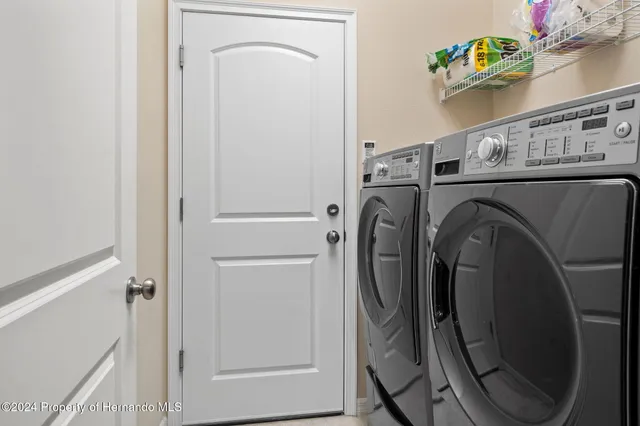 a view of a hallway with paintings on the wall