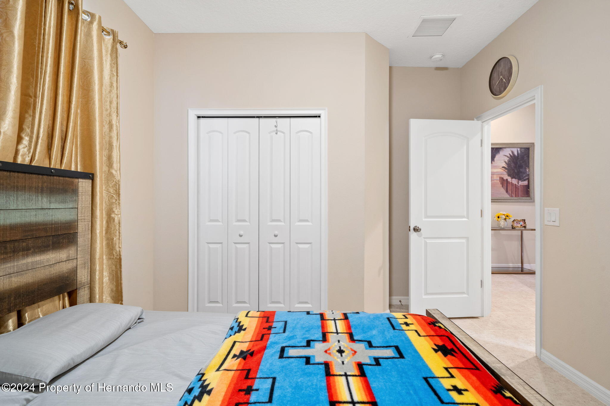 954 Old Windsor Way Spring Hill, FL 34609 - Photo 15 of 32 a room that has a bed and a table in it