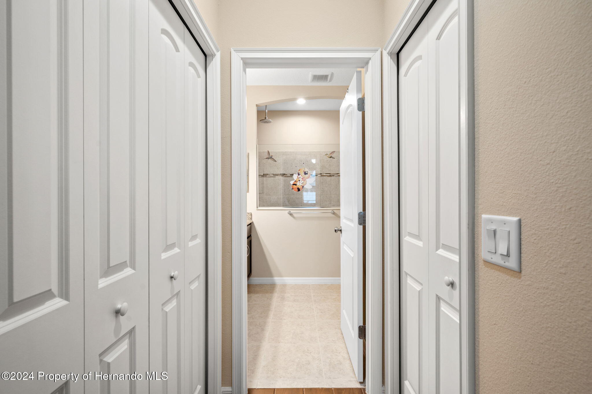 954 Old Windsor Way Spring Hill, FL 34609 - Photo 23 of 32 a view of a bathroom with a glass door
