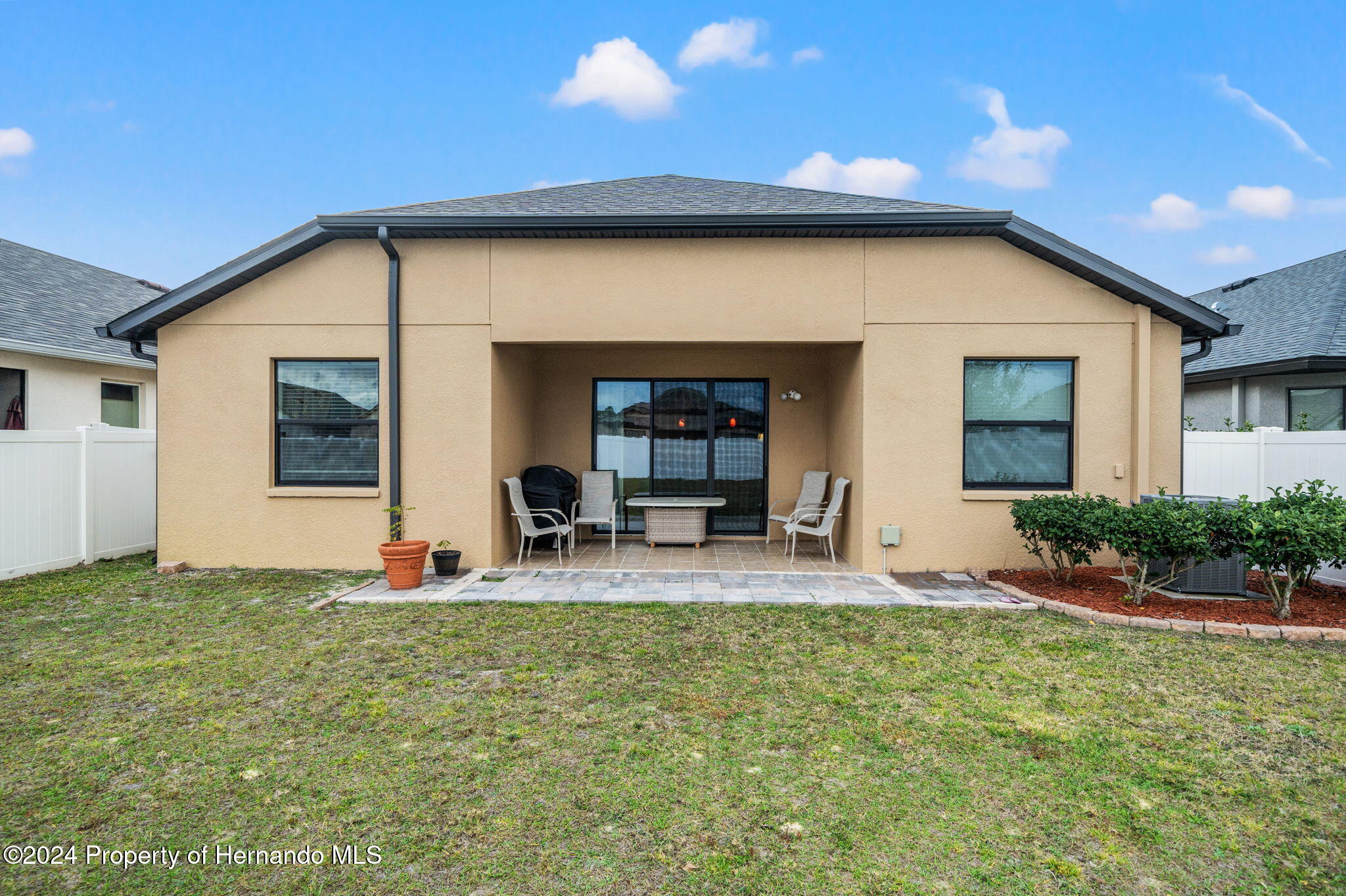 954 Old Windsor Way Spring Hill, FL 34609 - Photo 26 of 32 a house view with a sitting space