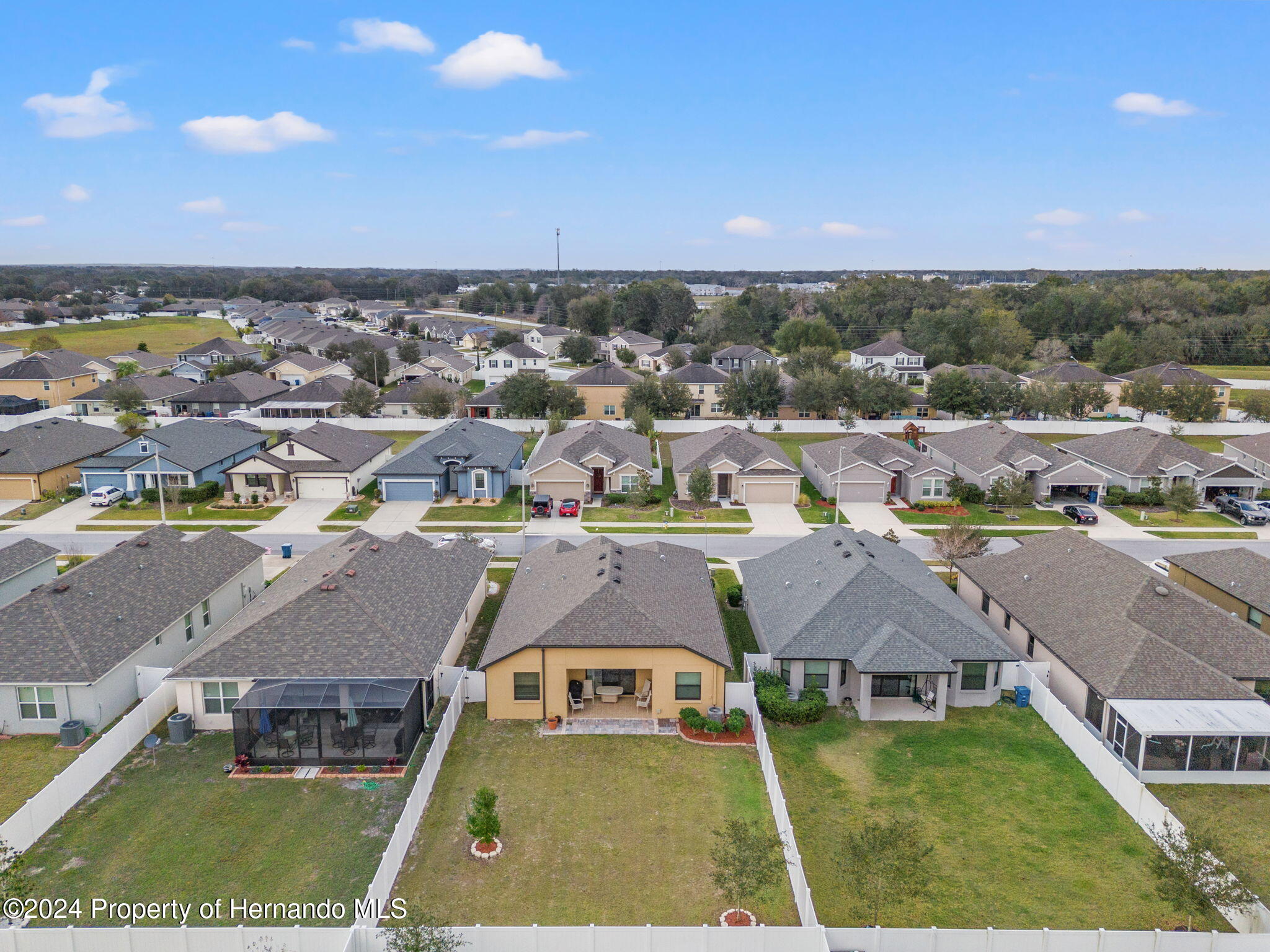 954 Old Windsor Way Spring Hill, FL 34609 - Photo 30 of 32 an aerial view of residential houses with outdoor space and swimming pool