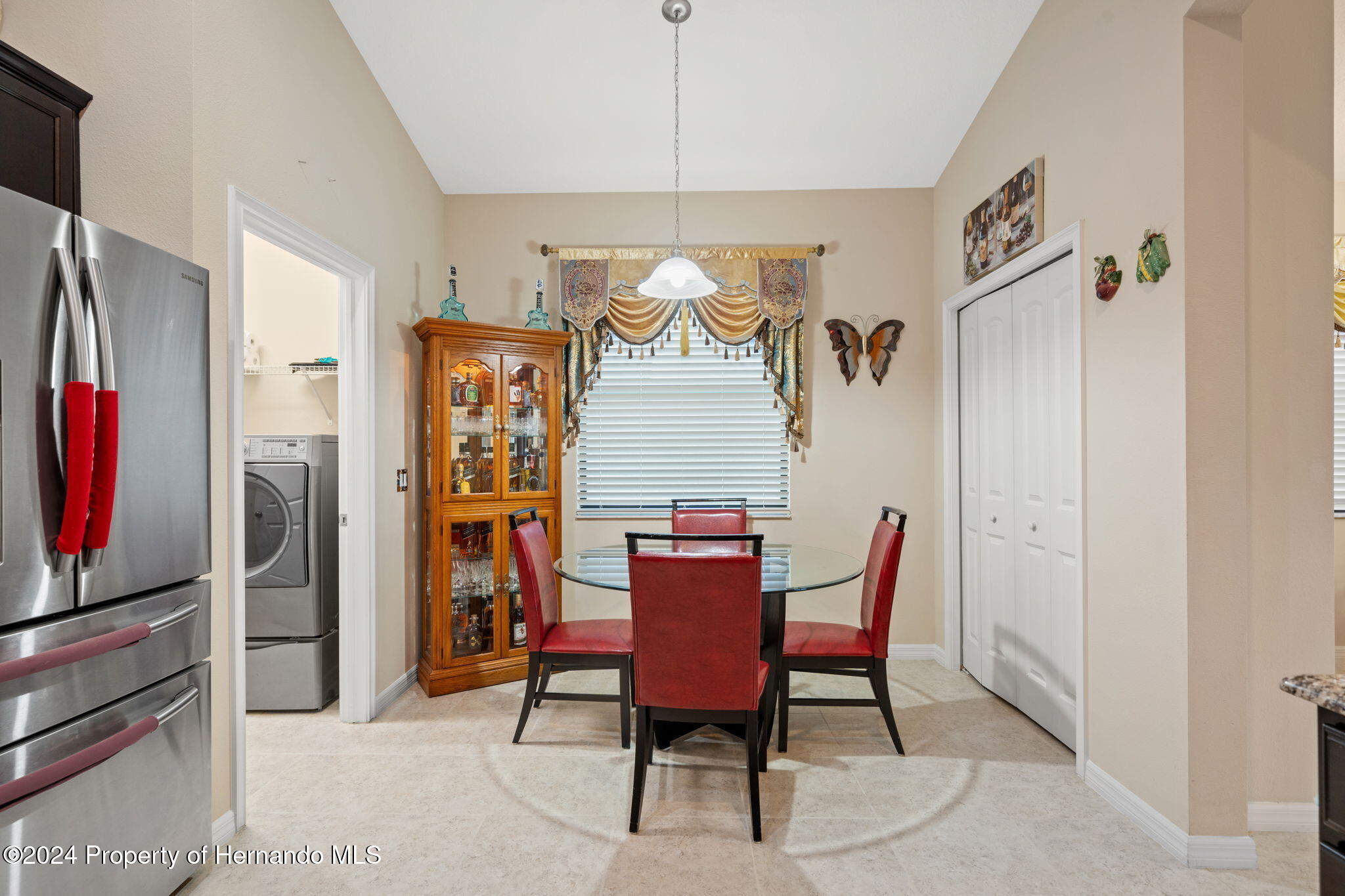 954 Old Windsor Way Spring Hill, FL 34609 - Photo 10 of 32 a dining room with furniture and window